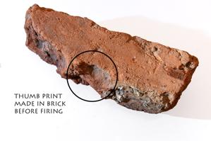 Thumb print on face of brick; 1642
